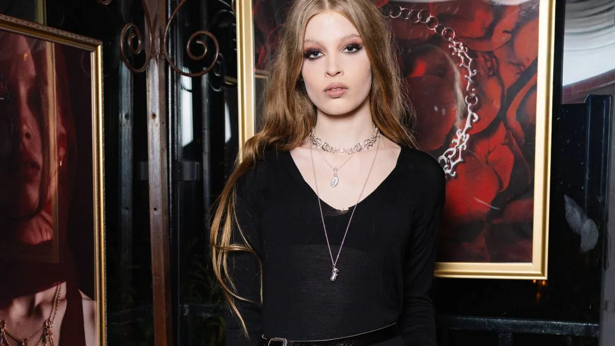 model uses live snake in jewelry campaign